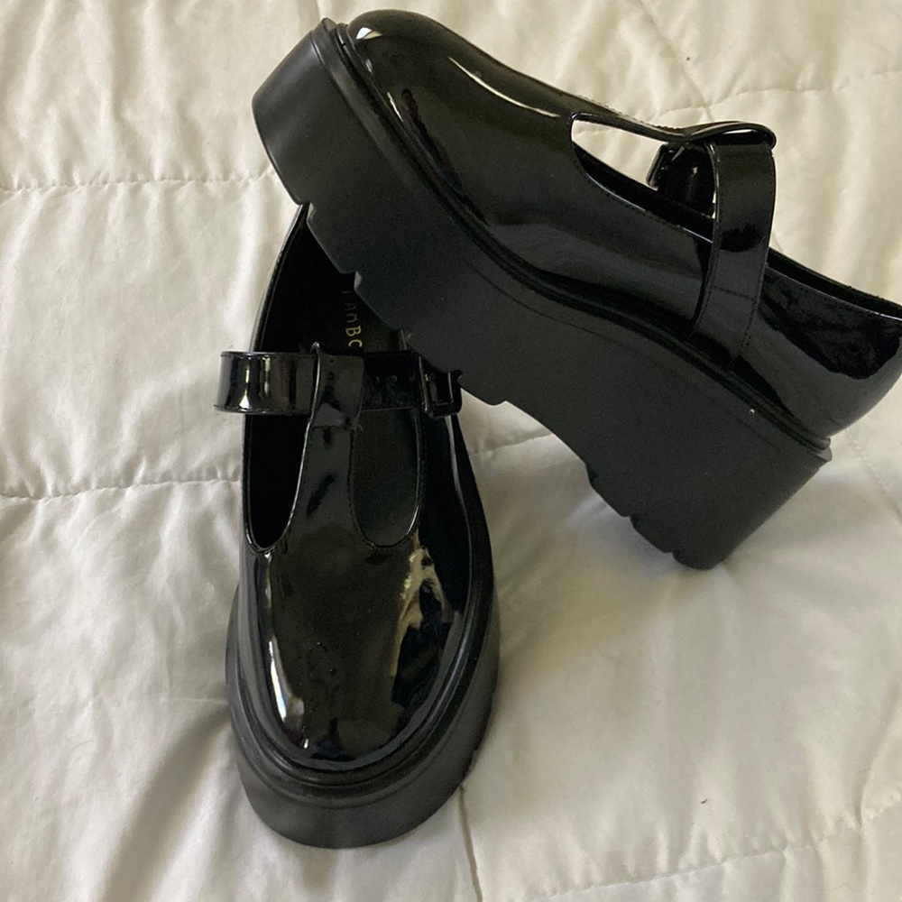 New, Never worn.  Patent leather size 8 Bamboo.